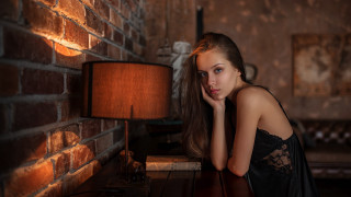 Woman leaning table lamp brick - a lamp free wallpaper