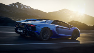 Blue sports car mountains sunset - a blue sports car free wallpaper for desktop