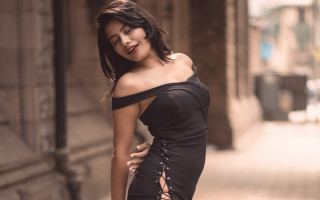 Woman black dress street pose - a street corner free wallpaper