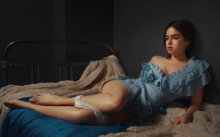 Woman blue dress bed crossed - fine art free wallpaper