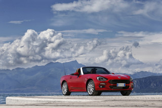 Red convertible car concrete slab - correggio free wallpaper
