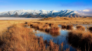River drygrass mountains blue sky - a dry grass free wallpaper