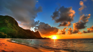 Sunset beach mountain person forest - the beach in the foreground free wallpaper