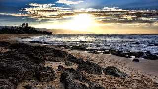 Beach rocks water cloudy sky 16 - rock and water under a cloudy sky free wallpaper
