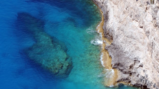 Water rock formation aerial naturalism - a body of water below free wallpaper