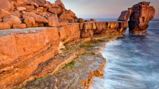 Rocky cliff water formation autumn - a rocky cliff free wallpaper