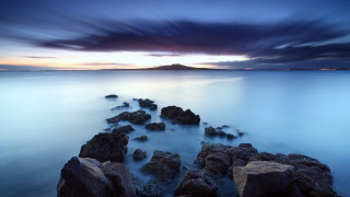 Rocky beach dusk mountain water - a long exposure free wallpaper
