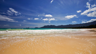 Beach waves mountain sky clouds - a mountain in the distance free wallpaper