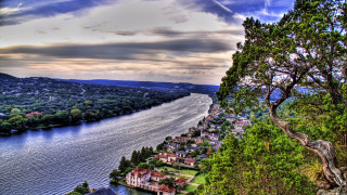 Lush river forest hillside town - a lush green hillside free wallpaper