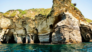 Large rock formation ocean cliff - the water below free wallpaper