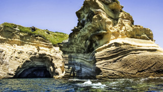 Ocean rock formation cliff person - bascove free wallpaper for desktop