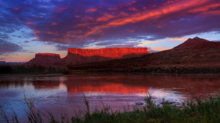 Sunset mountain lake red cliff - a beautiful sunset over a mountain lake free wallpaper