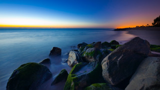 Sunset beach rocks water mountains 2 - rock and water free wallpaper
