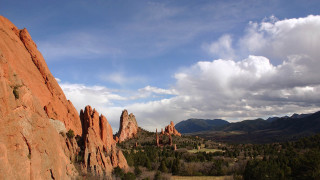 Valley mountains clouds trees landscape 2 - a view of a valley free wallpaper