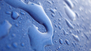 Blue water drops macro background - a blue surface free wallpaper for desktop