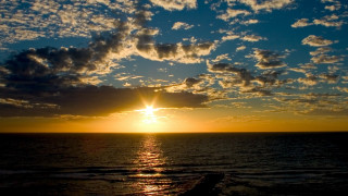 Sunset ocean clouds sky reflection - a sunset over the ocean free wallpaper