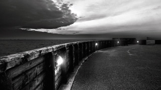 Long wooden pier light dark - a dark sky in the background free wallpaper