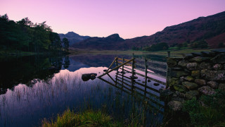 Wooden dock lake sunset mountains - rich moody colour free wallpaper