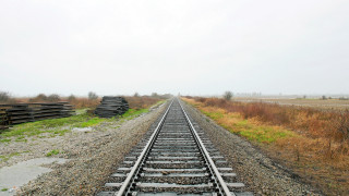 Train tracks field trees liminal - a field in the background free wallpaper