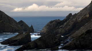 Rocky coastline water sky island - widescreen free wallpaper