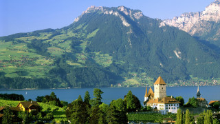 Church lake mountains town bridge - a mountain range in the distance free wallpaper