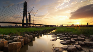 Bridge river sunset rocks cityscape 2 - a bridge over a river free wallpaper