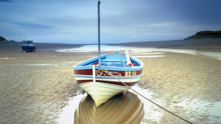 Boat beach ocean cloudy sky - sandy free wallpaper