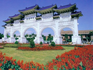 White building arches flowers blue - a white building free wallpaper