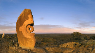 Desert rock carved face landscape - a face free wallpaper