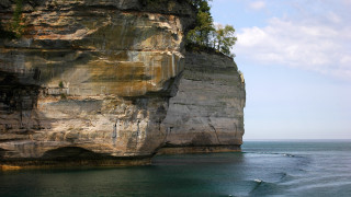 Surfboard cliff tree polarizing blue - dick bickenbach free wallpaper