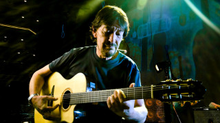 Man playing guitar microphone stand 2 - ignacio fernandez rio free wallpaper