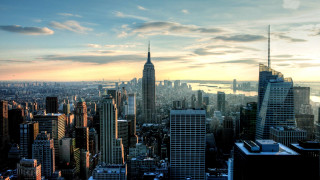 City skyline tall buildings water 3 - a sunset in the background free wallpaper