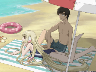 Beach umbrella couple sand shells - a man and a woman free wallpaper