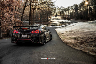 Black sports car woods road - its light free wallpaper for desktop