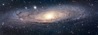 Spiral galaxy bright light blue - a blue star free wallpaper