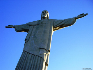 Jesus statue blue sky cloud - against a blue sky background free wallpaper