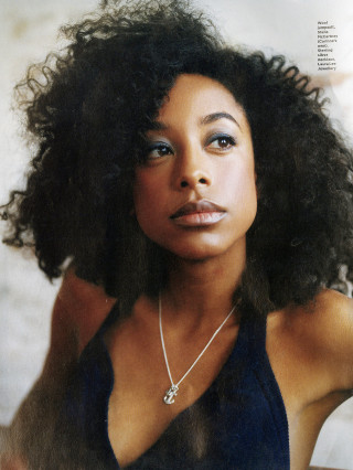 Woman afro necklace posing picture - free vintage wallpaper