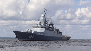 Large gray ship floating water 2 - water under a cloudy sky free wallpaper