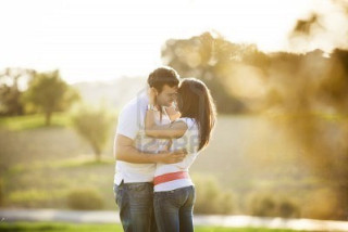 Man woman embracing park sun - romantic free wallpaper