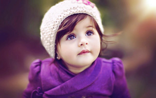 Little girl purple hat looking - a little girl free wallpaper
