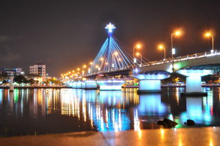 Bridge water night lights city 19 - a city in the background free wallpaper