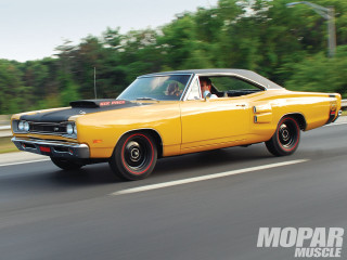 Yellow car driving street forest - a person in the driver seat free wallpaper