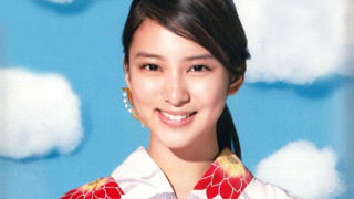 Woman flowered shirt earrings blue - cloud behind her free wallpaper