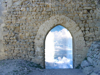Stone wall window sky reflection - a stone wall free wallpaper