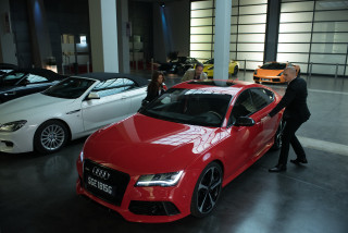 Man suit red car showroom - viennese actionism free wallpaper