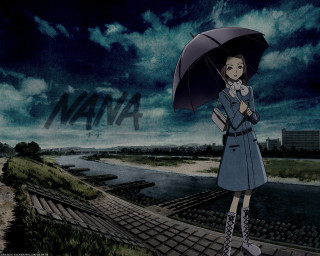 Woman umbrella train track night - under a cloudy sky free wallpaper