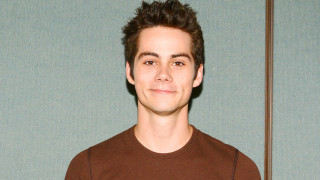Man brown shirt blue wall - short smile free wallpaper