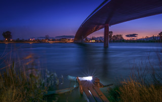 Boat bridge night sunlight reflection - under a bridge free wallpaper