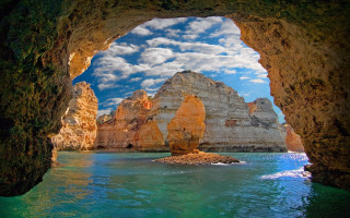 Cave ocean mountains sky boat - cloud above free wallpaper