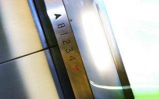 Metal door clock light closeup - diffuse free wallpaper